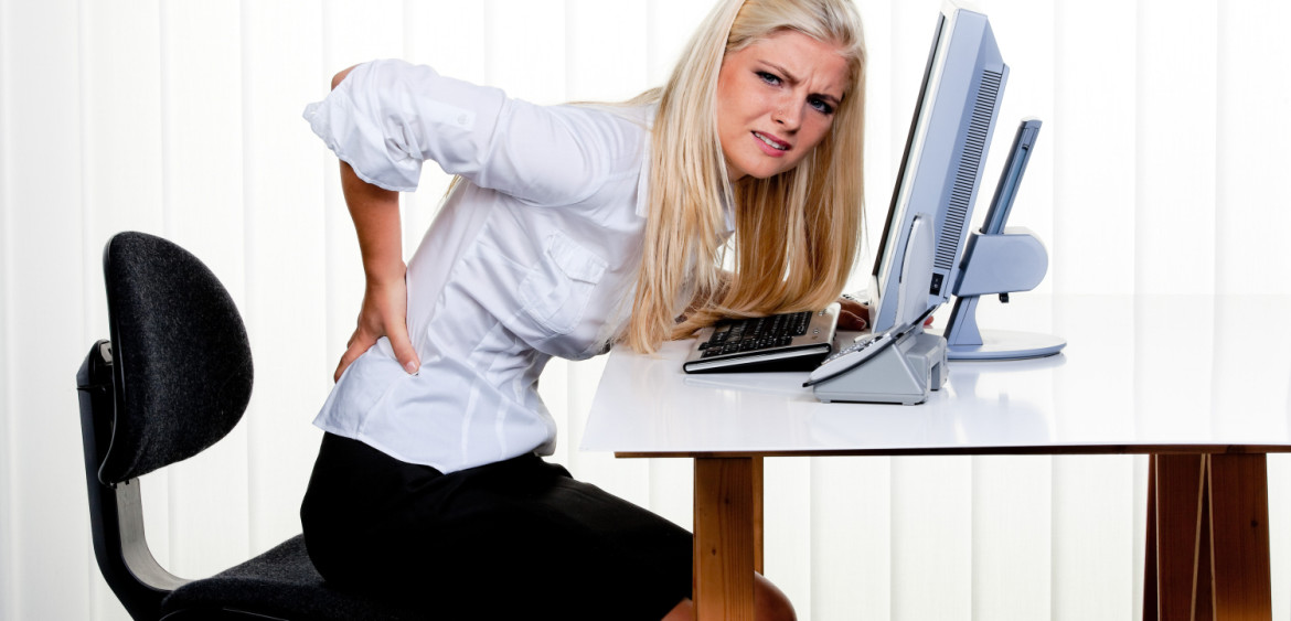 Woman with pain in the back office